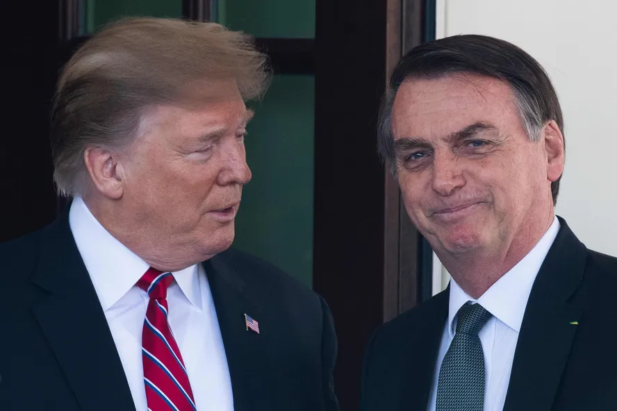 Donald Trump e Jair Bolsonaro — Foto: Jim Watson/AFP